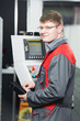worker at machining tool workshop