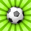 Glossy soccer ball over green rays Glossy soccer ball over green rays