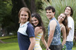 Photo: Portrait of a beautiful young guy and friends group Portrait of a beautiful young guy and friends group