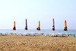 chairs and colorful umbrella on sand beach chairs and colorful umbrella on sand beach