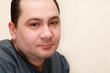 Photo: portrait of middle-aged quiet man in gray shirt portrait of middle-aged quiet man in gray shirt