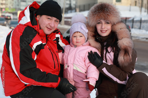Photo: mother and father kept his little daughter, winter mother and father kept his little daughter, winter