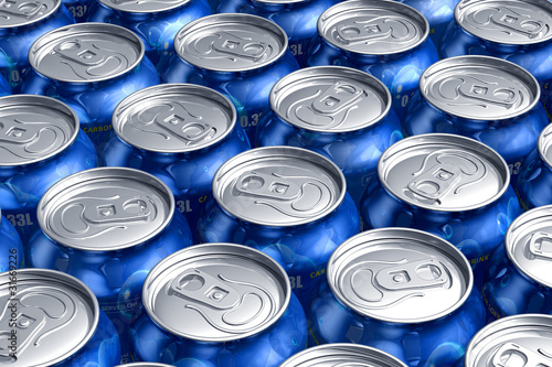 Photo: Macro of metal cans with refreshing drinks or beer Macro of metal cans with refreshing drinks or beer