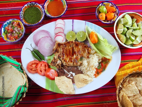 Photo: Beef ribs mexican style vegetables chili sauce nachos Beef ribs mexican style vegetables chili sauce nachos