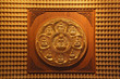 golden wheel of buddha on wall in dragon temple Thailand