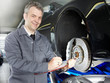 Master mechanic writing down repair and maintenance costs