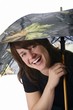 Woman Laughing With An Umbrella