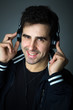 Handsome young man listening the music in headphones