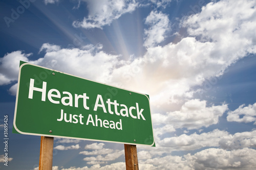 Photo: Heart Attack Green Road Sign and Clouds Heart Attack Green Road Sign and Clouds