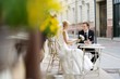 Bride and groom at outdoor cafe