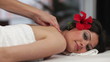 Beautiful young woman receiving back massage in Spa
