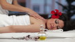 Beautiful young woman receiving back massage in Spa
