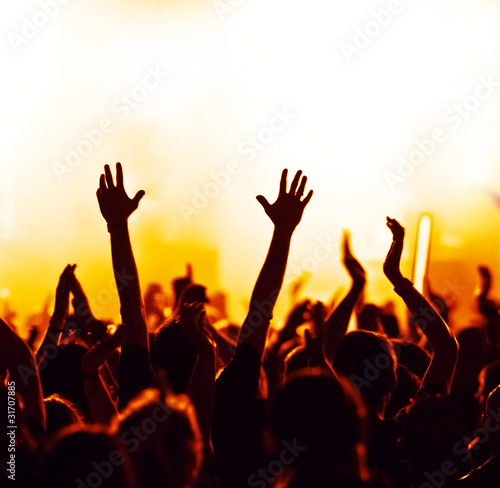 Photo: concert crowd in front of bright blue stage lights concert crowd in front of bright blue stage lights