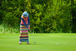Golfer from Jupan finishes his swing