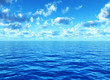 cloudy blue sky leaving for horizon above blue surface of sea cloudy blue sky leaving for horizon above blue surface of sea