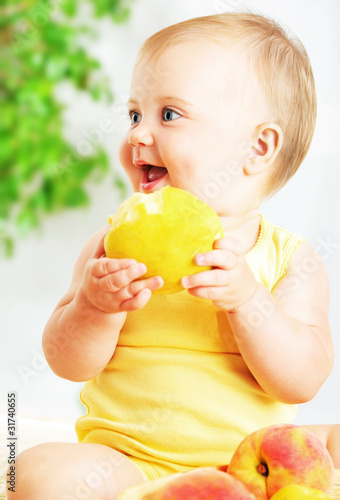 Photo: Little baby eating apple Little baby eating apple
