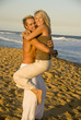 Young attractive couple embrace at beach