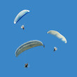 Photo: White blue paramotor on blue sky White blue paramotor on blue sky