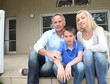 Portrait of family sitting on the front door stairs Portrait of family sitting on the front door stairs