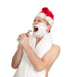 shaving man with foam and razor in red Christmsa hat
