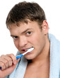 Young man brushing teeth