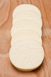 Round cheese slices in a row Round cheese slices in a row