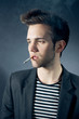 ����: Cool young man smoking a cigarette � Viktor Pravdica #31757664