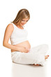 Pregnant blond woman isolated on white