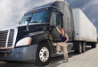 Woman driver with her commercial 18-wheeler   deisel semi truck.