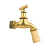 Old gold faucet closed with cork isolated on white