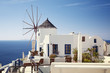 Photo: Windmill with view on Santorini Island (Oia village). Windmill with view on Santorini Island (Oia village).
