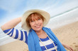 Portrait of smiling senior woman at the beach Portrait of smiling senior woman at the beach
