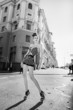 Photo: A girl standing on the street A girl standing on the street