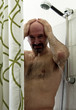 Bald man of fifty years in shower