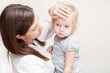 mother is holding a sick daughte mother is holding a sick daughte
