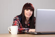 ����: Beautiful happy student doing homework on laptop � Darrin Henry #31828248