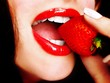 Woman eating strawberry