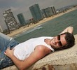 Handsome man relaxing near the sea