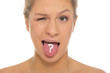 woman puts out tongue with drawn question mark