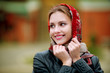 Young beautiful woman in a red scarf