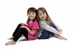 Two Adorable little girls isolated on white background