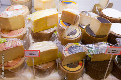 Photo: cheese on counter in market cheese on counter in market