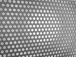 Carbon fibre surface with holes