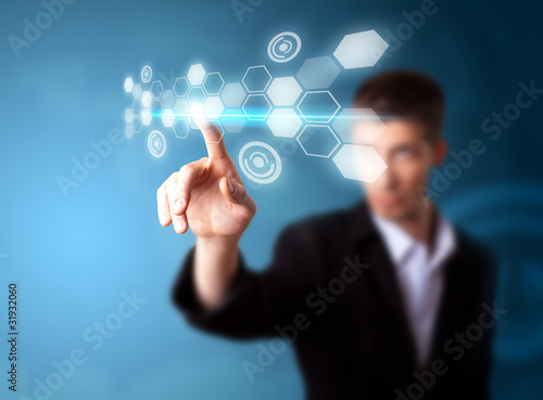 Foto: A businessman working on modern technology A businessman working on modern technology