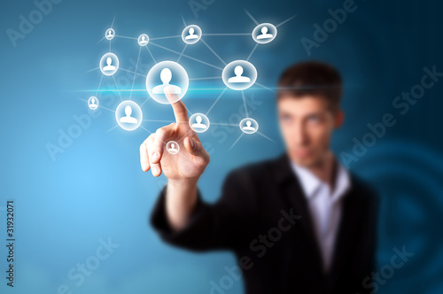 Photo: A businessman working on modern technology A businessman working on modern technology