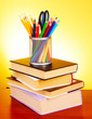 Stationery and books  on red background