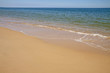 Sand and waves of a beach in Algarve, Portugal Sand and waves of a beach in Algarve, Portugal