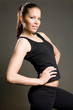 Gorgeous young fitness brunette poser.