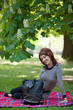 portrait of a girl in a park with a bag portrait of a girl in a park with a bag
