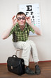person wearing spectacles in an office at the doctor